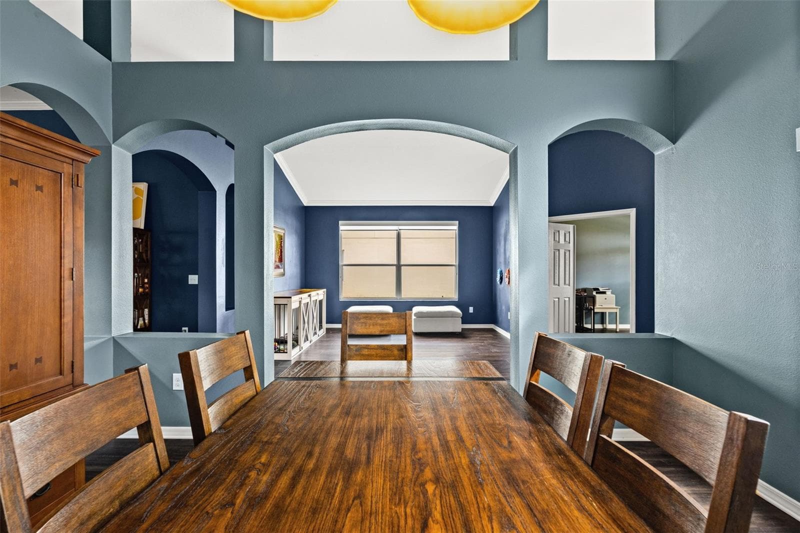 High ceilings, arched openings, and generous natural light give the main living spaces an airy, open feel. - 1419 BLUE MARLIN BLVD, HOLIDAY