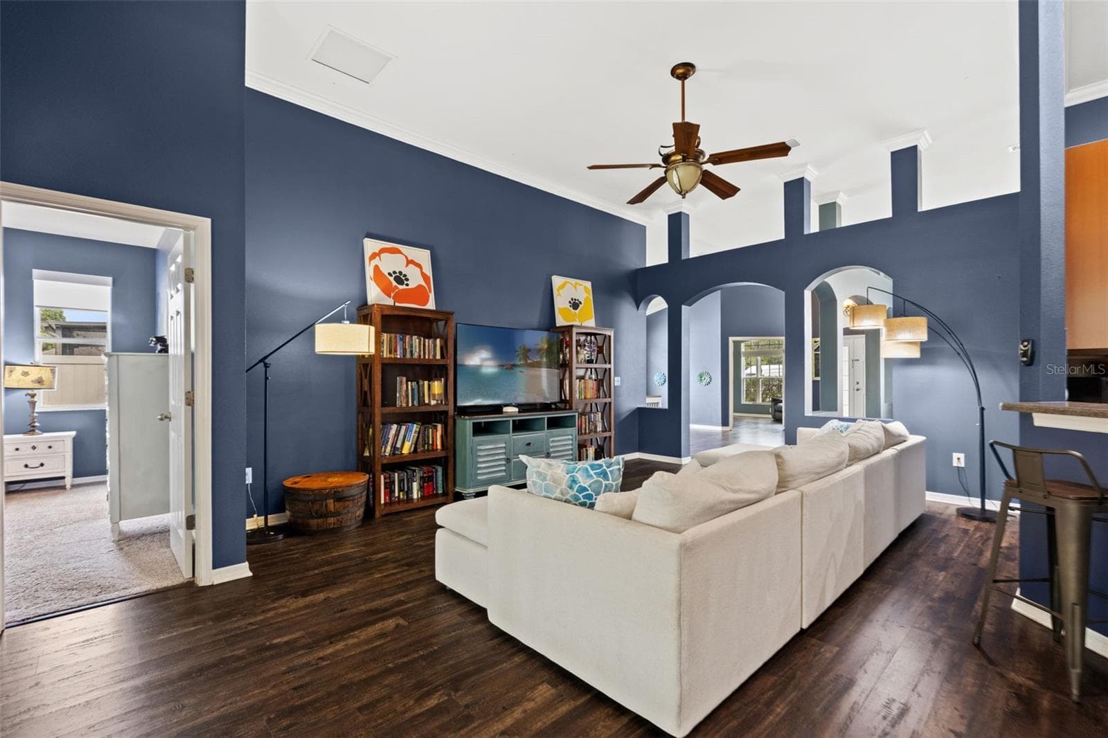 At the heart of the home, the family room offers plenty of space to gather while remaining open to the kitchen. - 1419 BLUE MARLIN BLVD, HOLIDAY