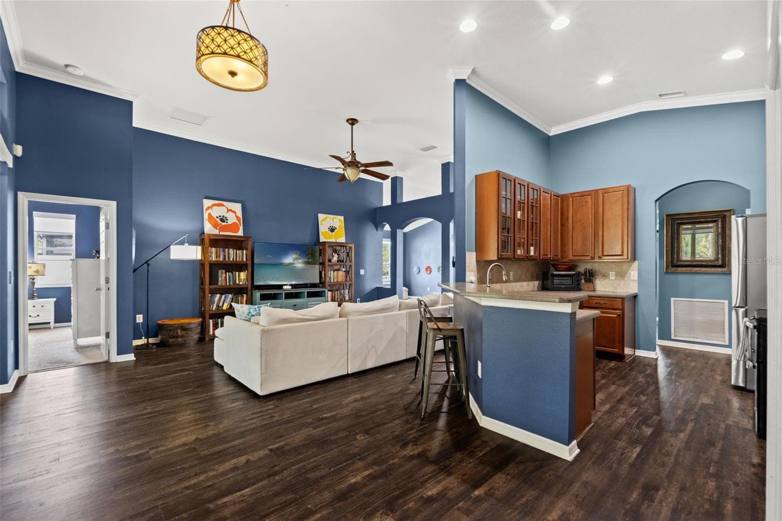 This open-concept hub brings the kitchen, family room, and outdoor living areas together for an easy Florida lifestyle. - 1419 BLUE MARLIN BLVD, HOLIDAY