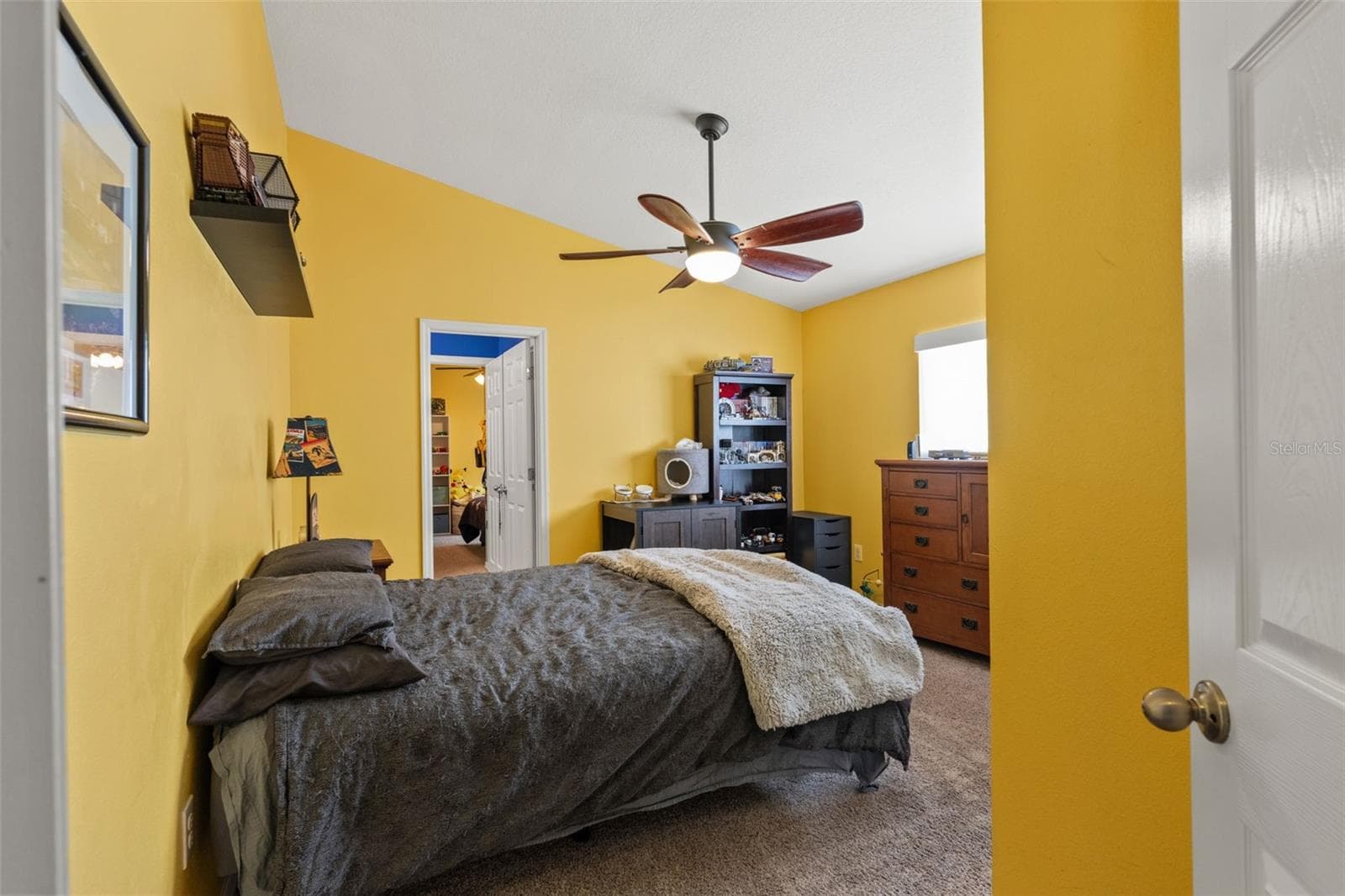 One of four bedrooms, this generously sized room offers flexibility for family, guests, or additional work-from-home space. - 1419 BLUE MARLIN BLVD, HOLIDAY