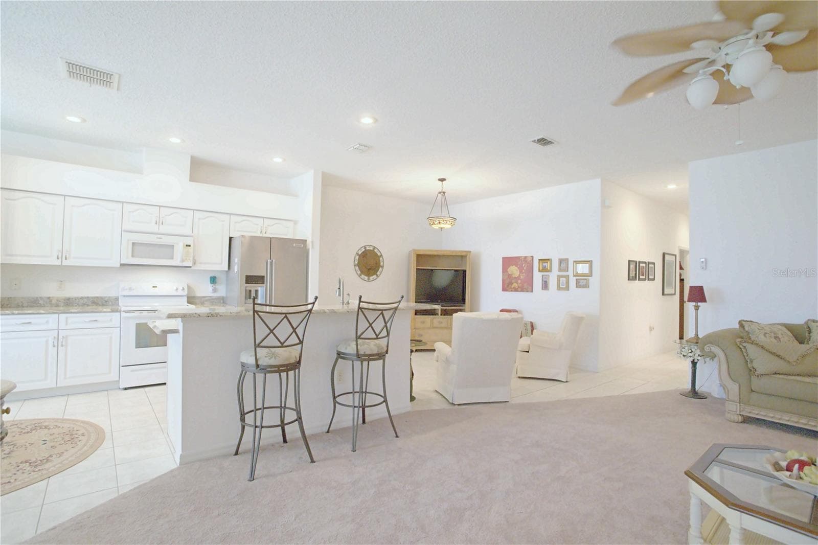 Living room open to kitchen - 91 CLUB VILLAS LN, KISSIMMEE