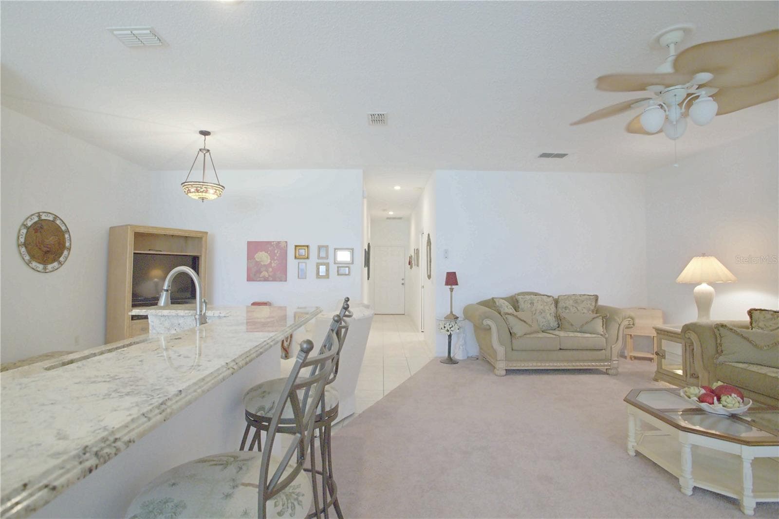 Kitchen open to living room - 91 CLUB VILLAS LN, KISSIMMEE