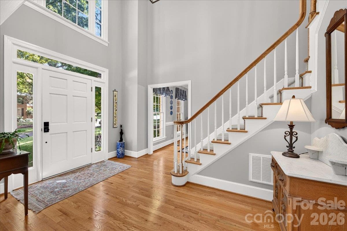 Lovely wood flooring in this 2-story foyer and throughout the main floor. - 5919 Derry Hill Place, Charlotte