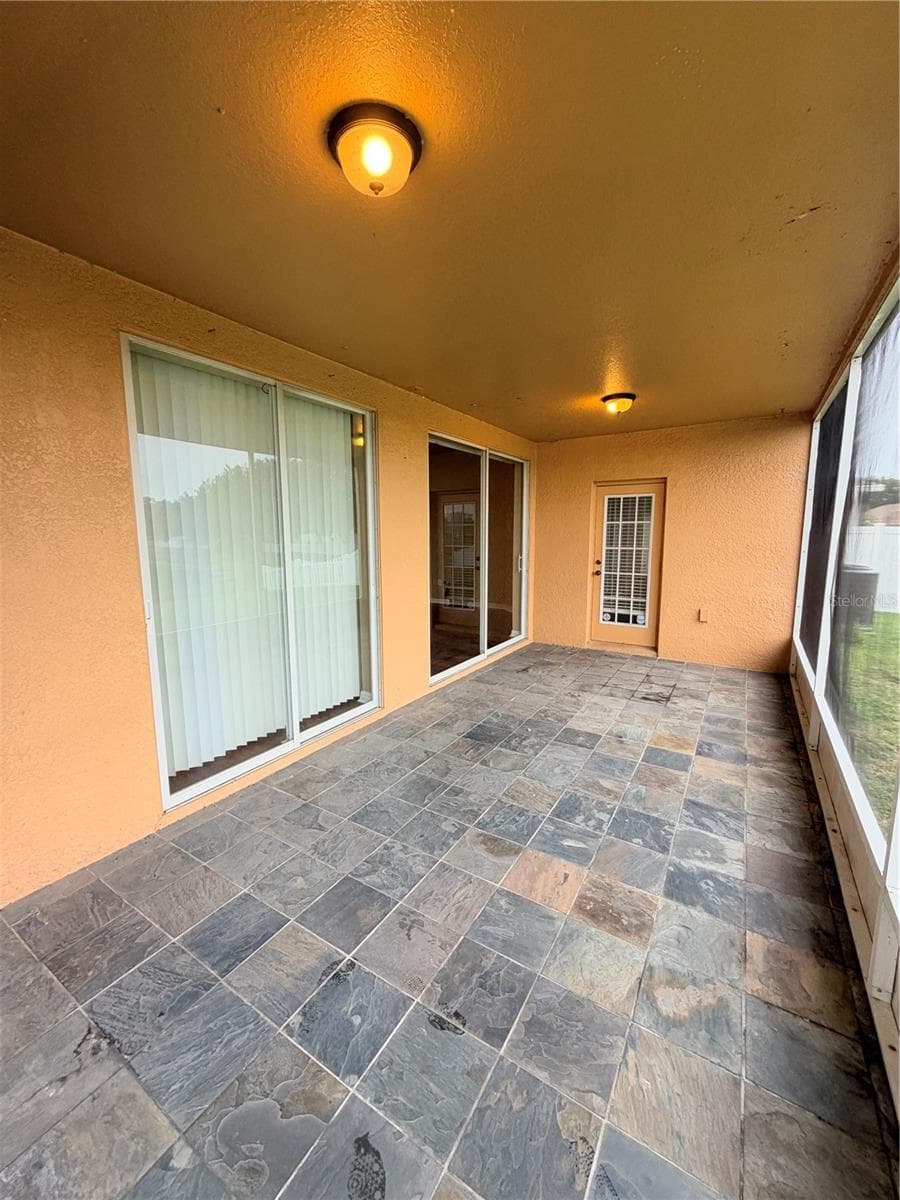 Screened-In Back Patio - 7516 TOWER BRIDGE DR, WESLEY CHAPEL