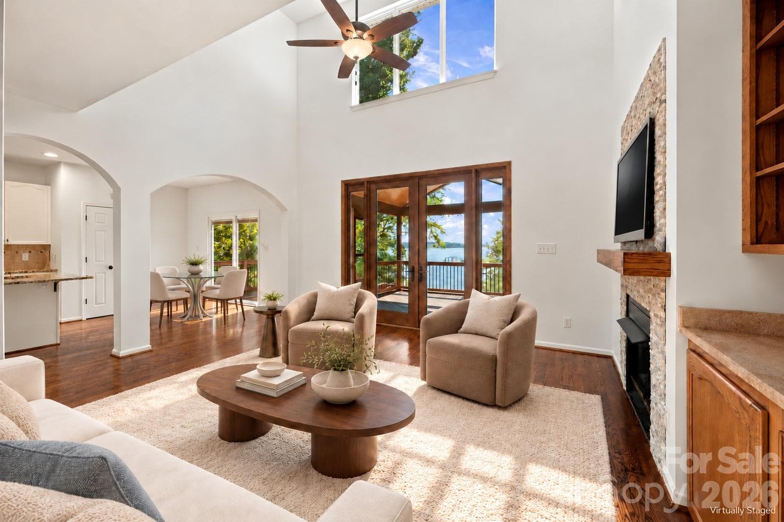 Large French doors open the room to the screened-in deck and beautiful lakeview staged - 3774 Gordon Road, Terrell