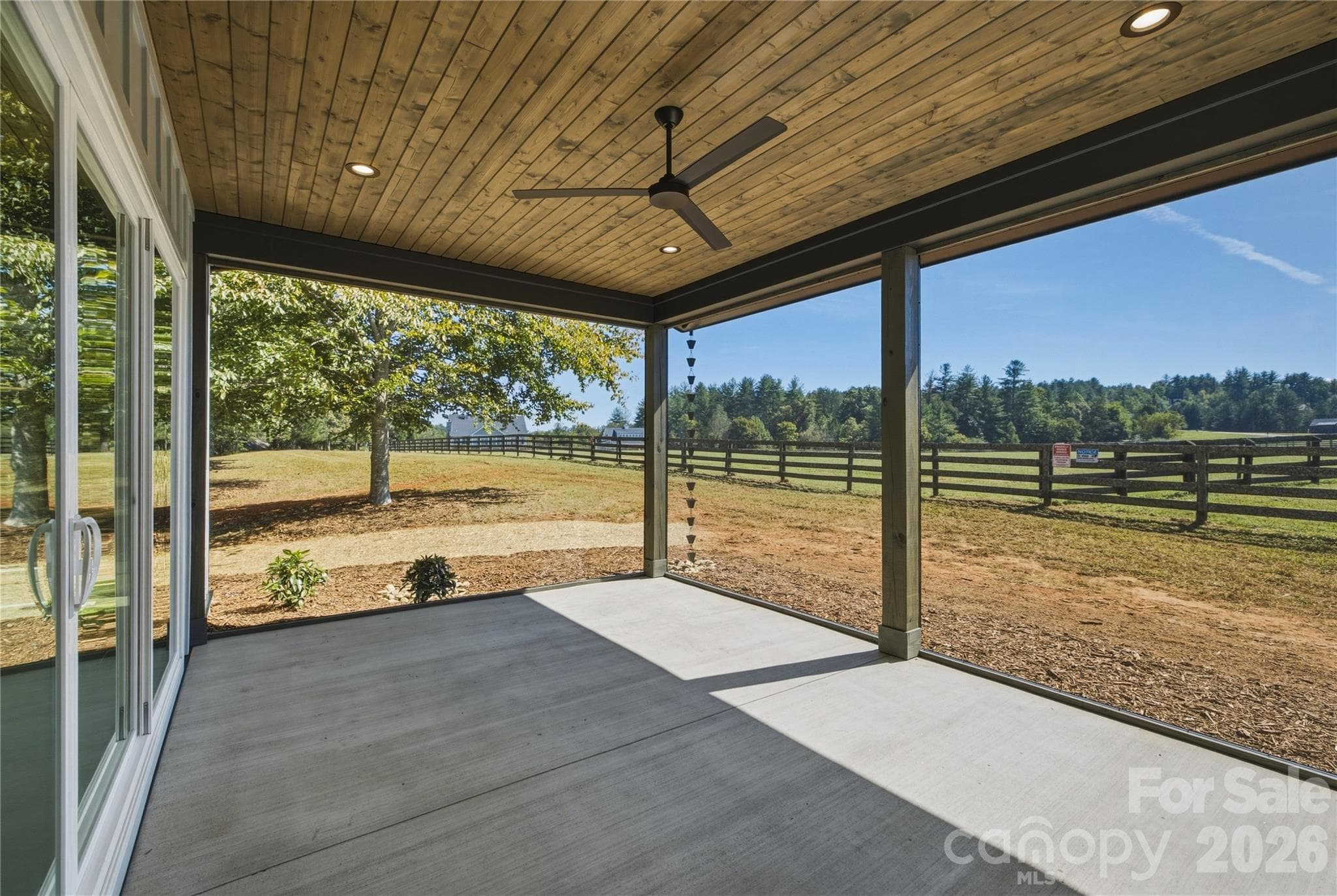 The screened-in back patio will be a delightful place for morning coffee or evening wine. The outdoor ceiling fan is a nice touch. - 2303 Paddock Circle, Morganton