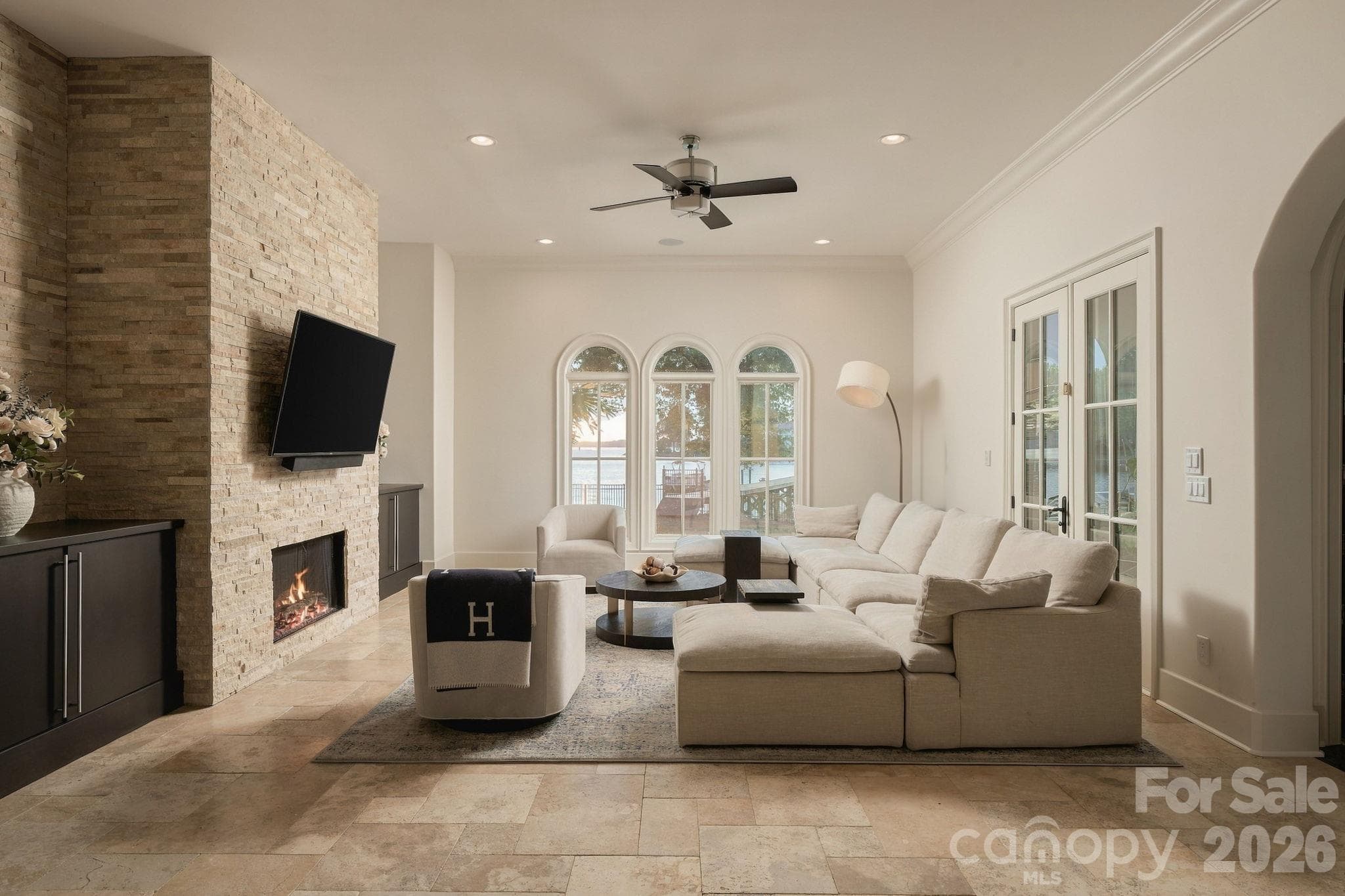 Great room with fireplace and endless views of the lake! - 21215 Senlac Lane, Cornelius