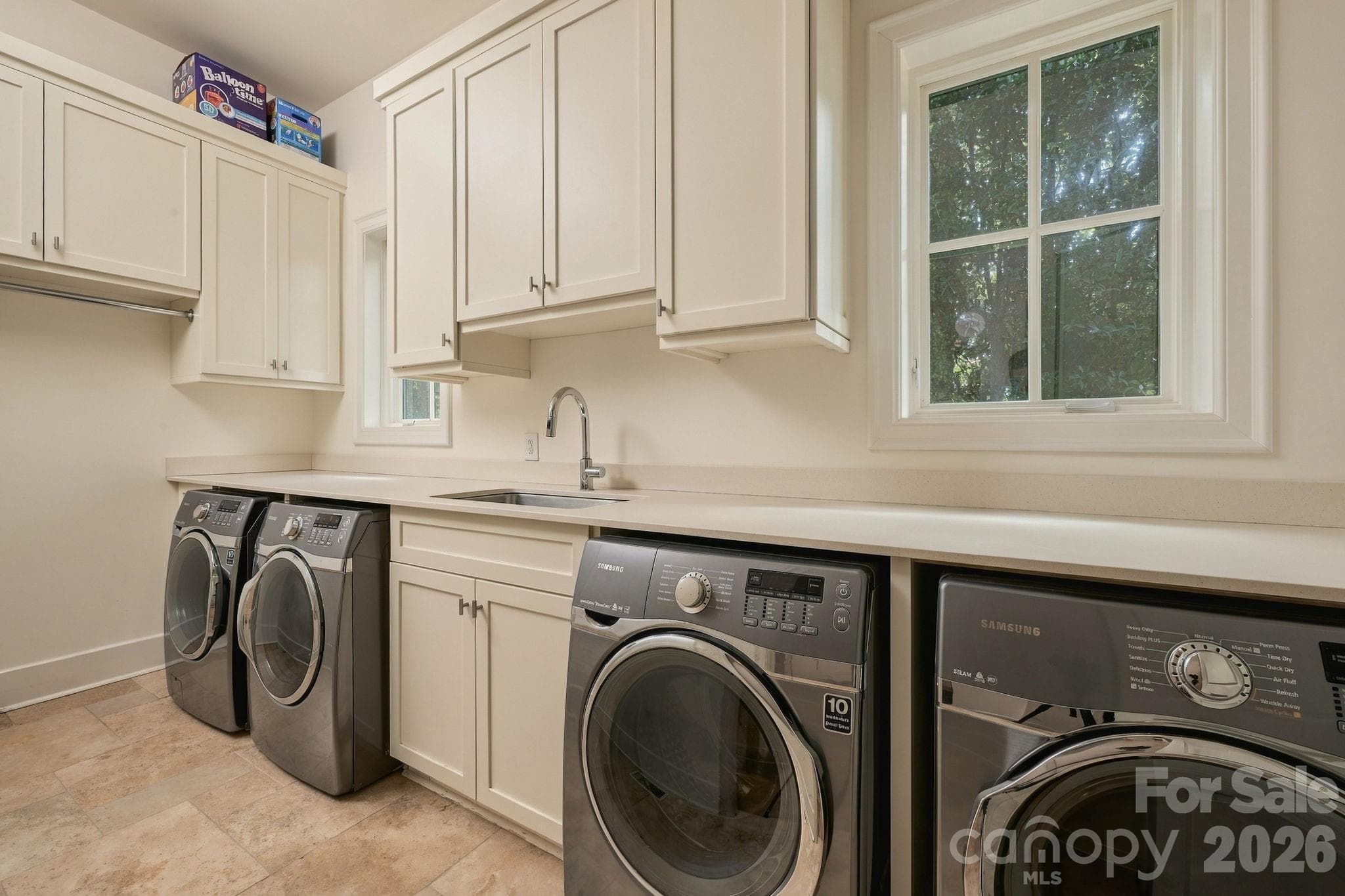 Downstairs large laundry room is a dream with 2 sets of washer/dryer that convey with the home! - 21215 Senlac Lane, Cornelius