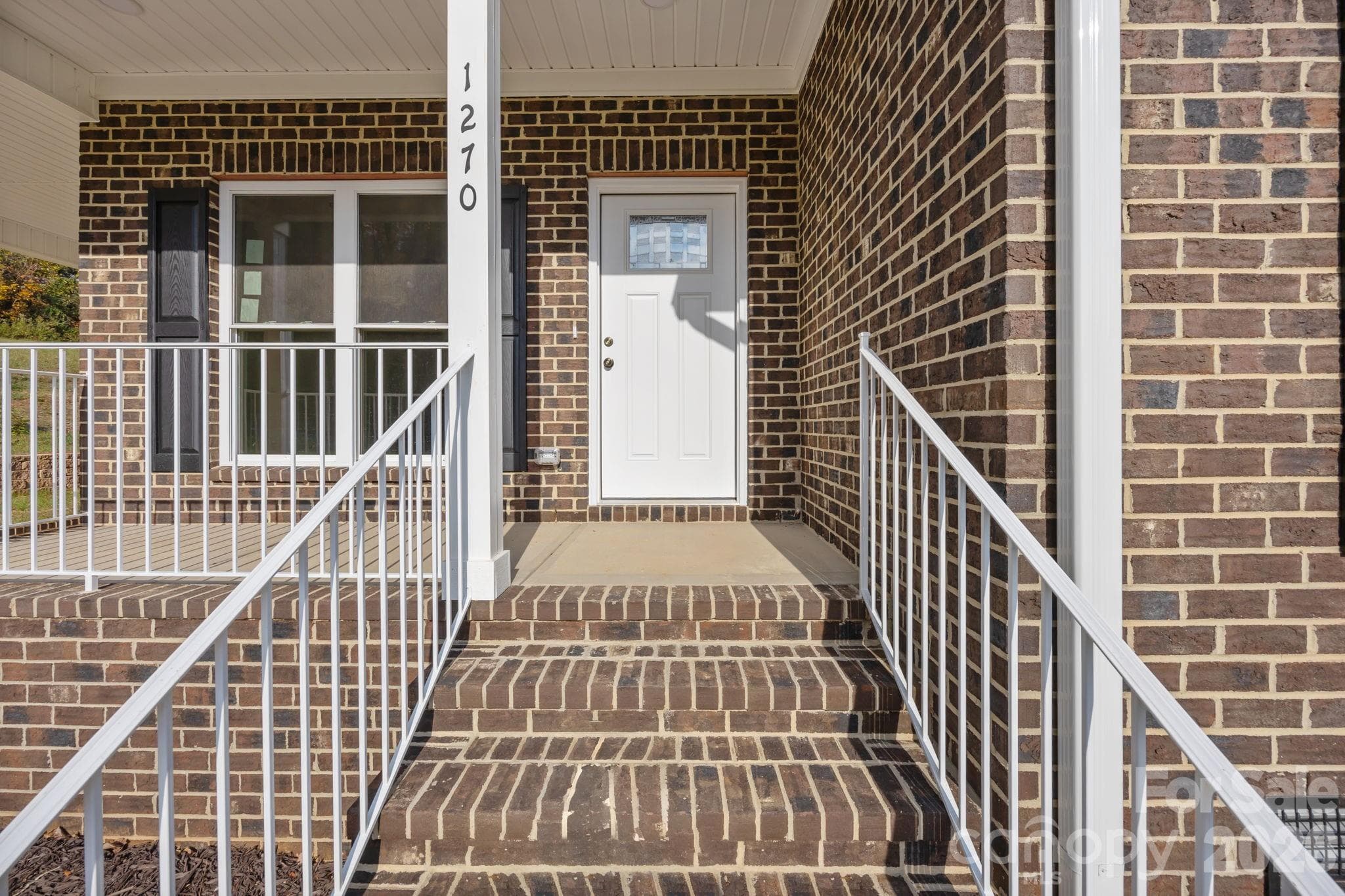 Nice brick steps leading to up to this inviting concrete front porch! - 1270 N Shaver Street, Salisbury