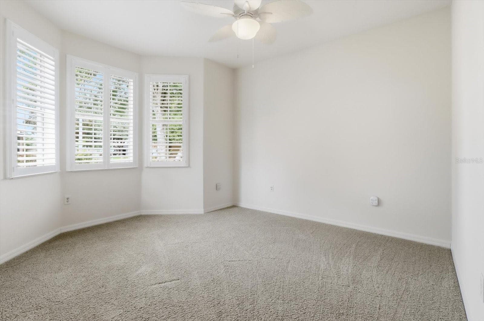 Guest bedroom 1 with bay widow - 8368 SW 79TH CIR, OCALA
