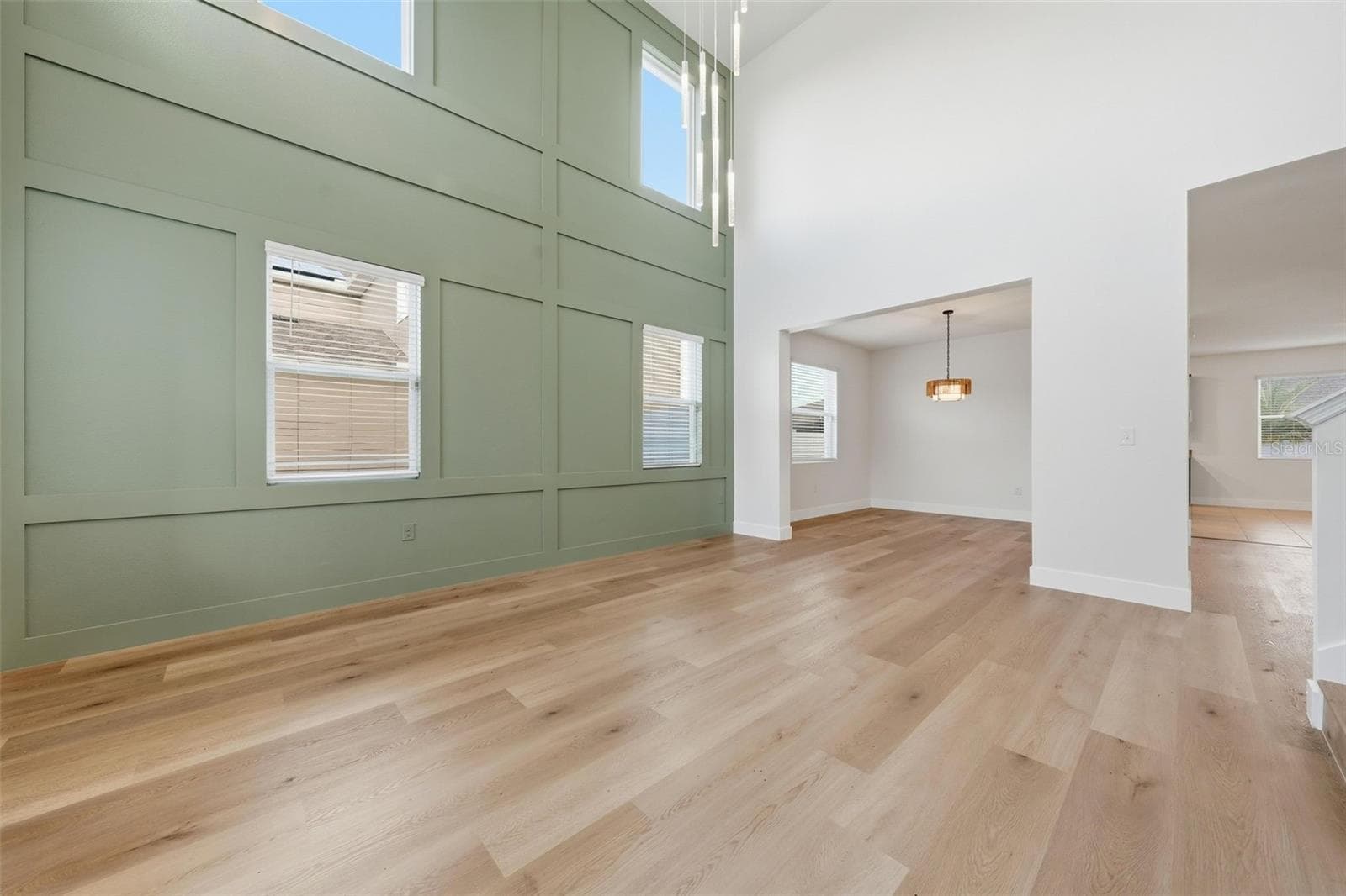 Custom paneled feature wall in the foyer - 5839 SW 86TH ST, OCALA