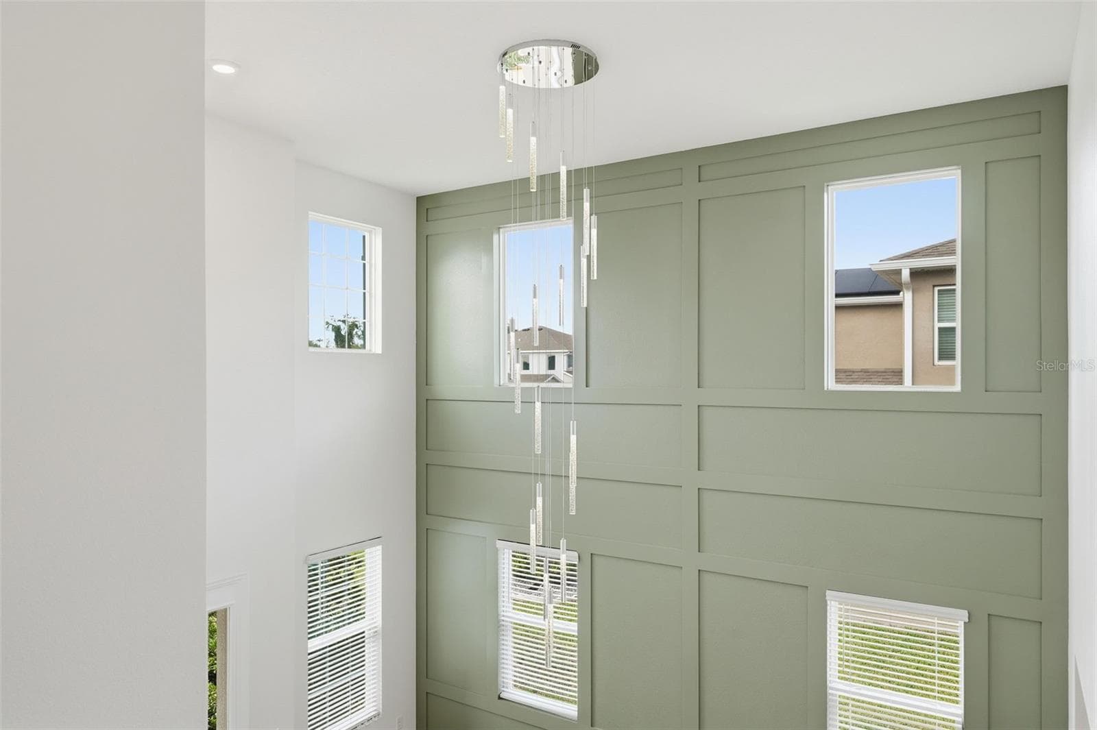 New chandelier anchors the two-story entry - 5839 SW 86TH ST, OCALA