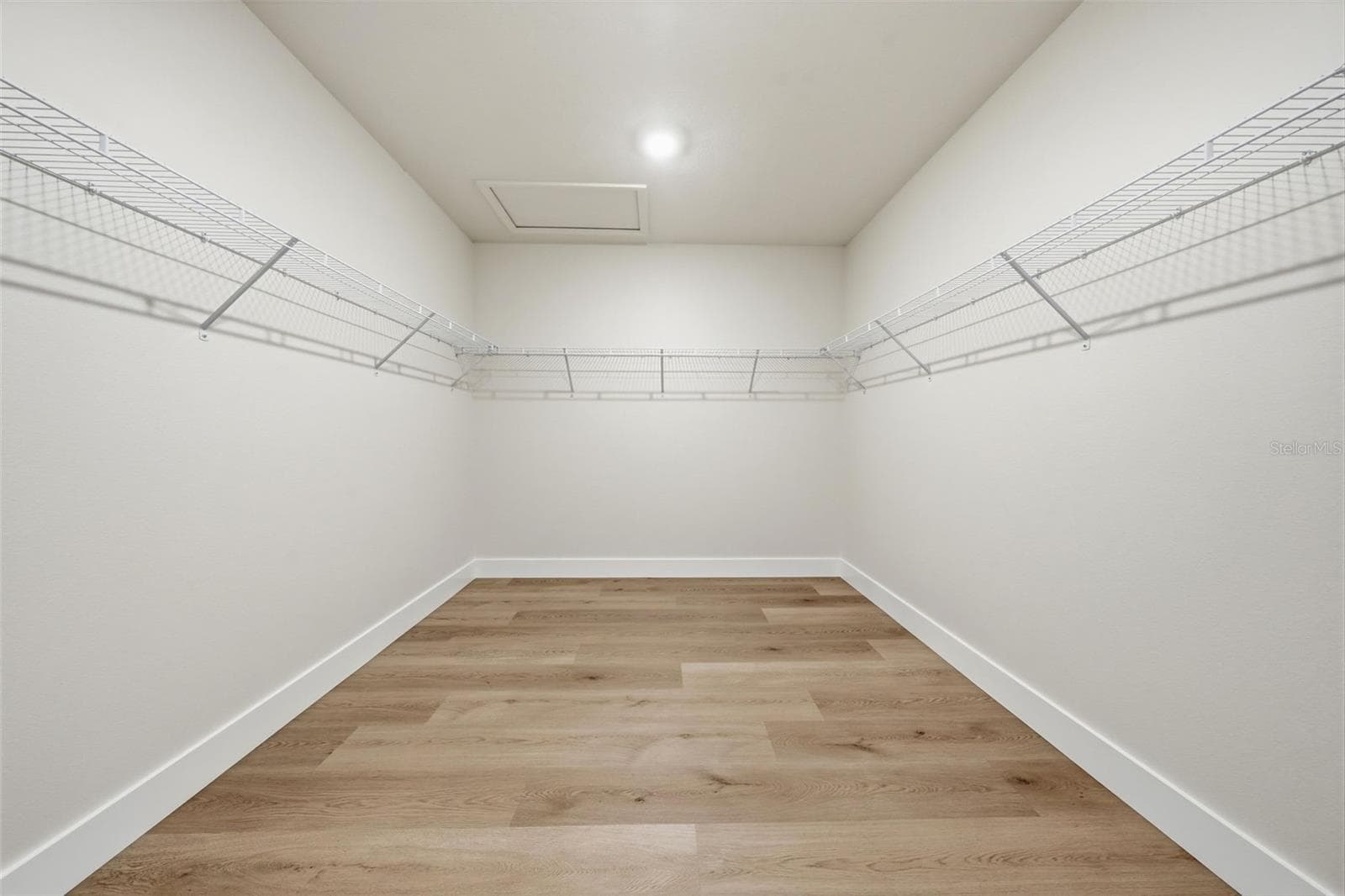 Huge primary walk-in closet ready for custom built-ins - 5839 SW 86TH ST, OCALA