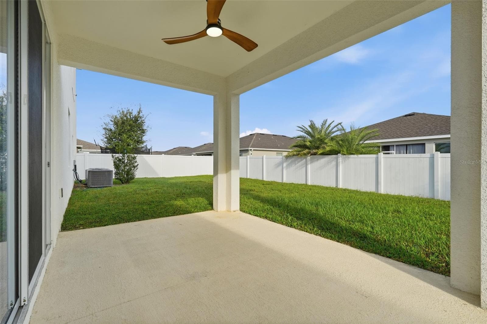 Covered lanai with ceiling fan. Room for pool in the backyard - 5839 SW 86TH ST, OCALA