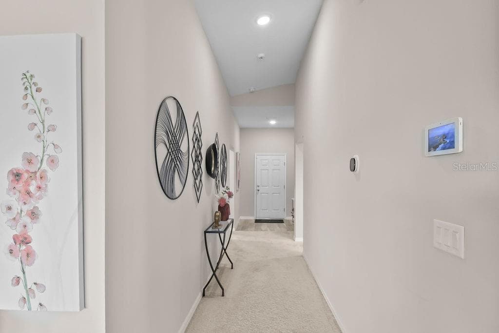 A welcoming entryway sets the tone for the comfort and style of the home. - 5945 SLATE ROCK DR, LAKELAND