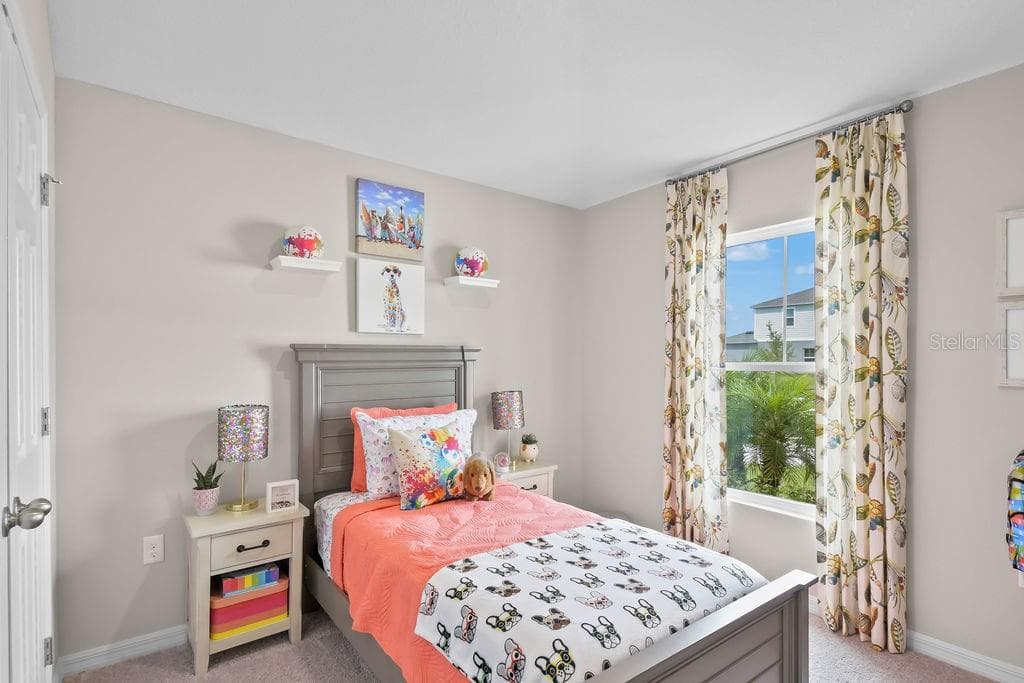 As you walk into the home there is 1 bedroom to the right. - 5945 SLATE ROCK DR, LAKELAND