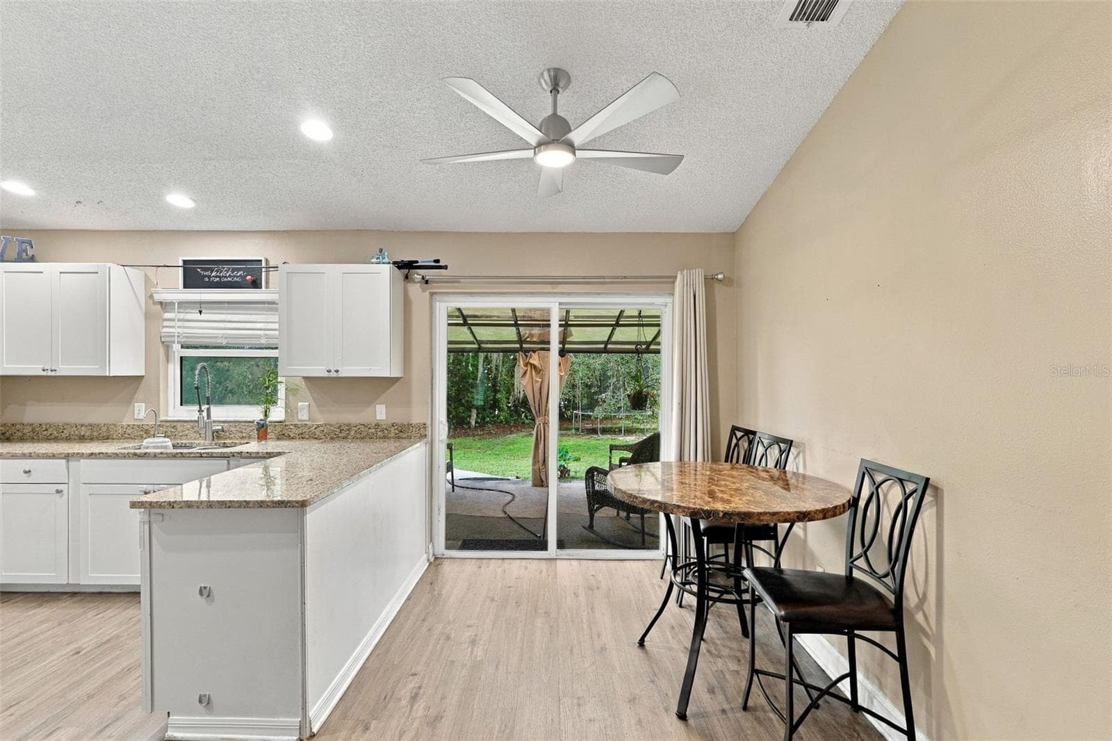 Kiten and breakfast bar with room for a dinette . - 2992 INCA CT, DELTONA