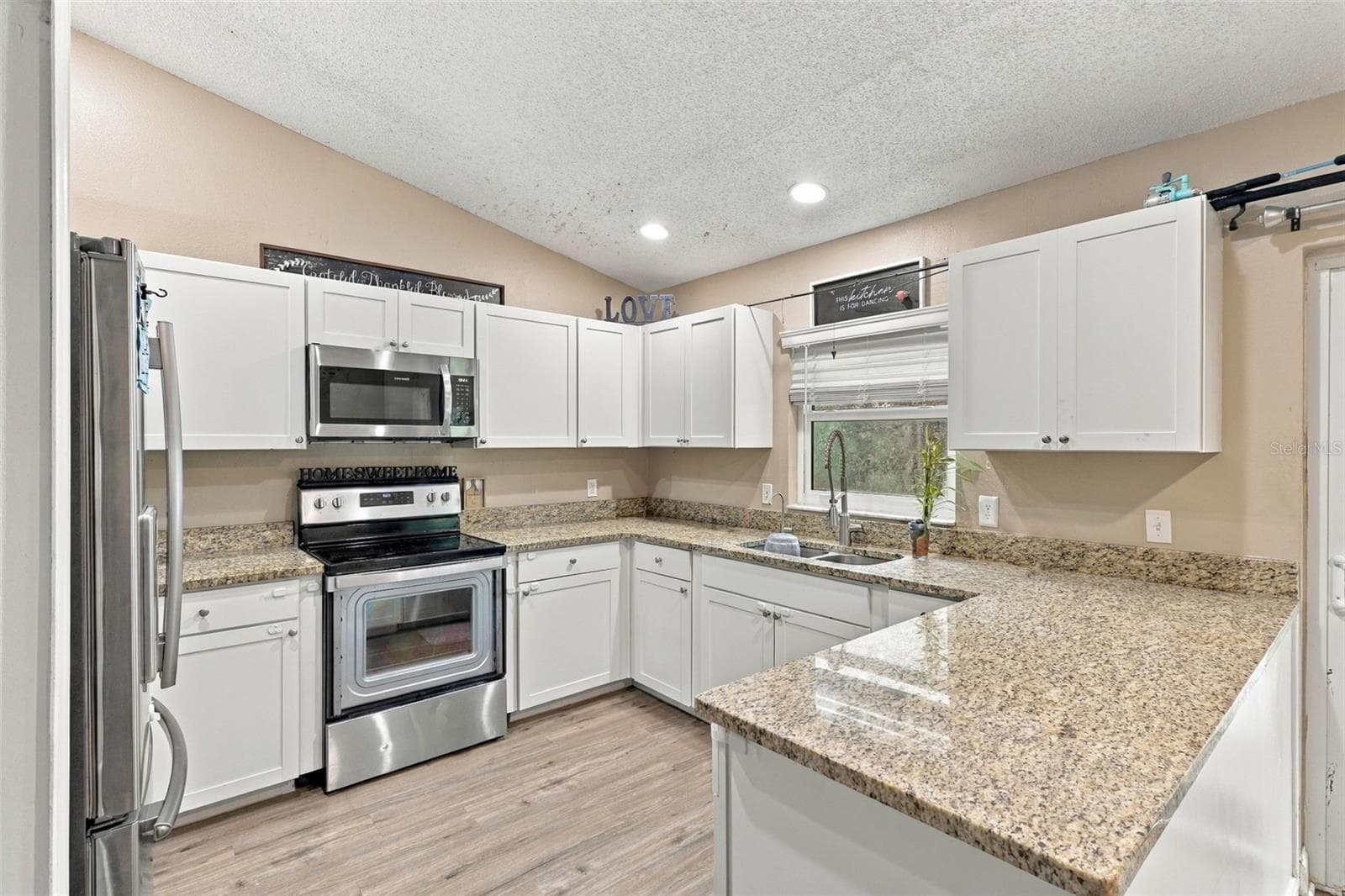 Stone countertops and stainless steel appliances. - 2992 INCA CT, DELTONA