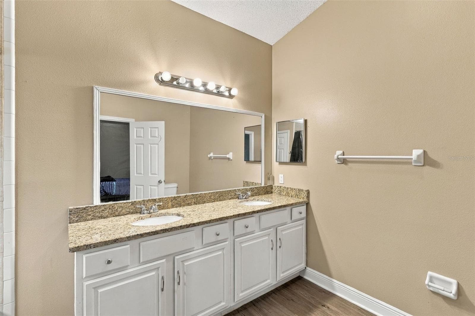 Primary bathroom, double sink vanity, stone countertop and large soaking tub and shower combo. - 2992 INCA CT, DELTONA