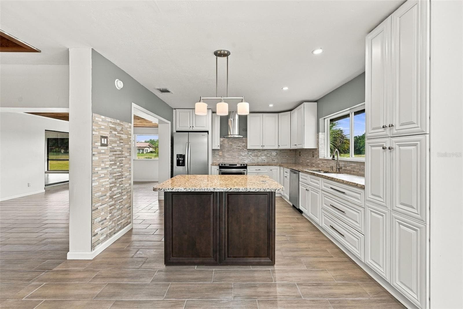 View from dining into kitchen - 15 ABBEY CT, HAINES CITY