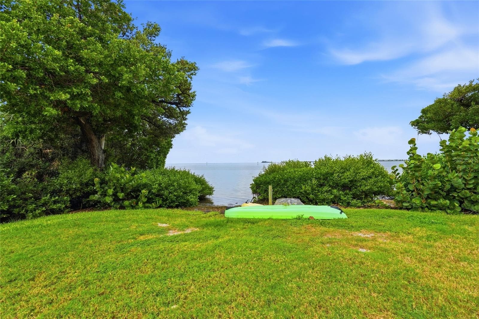 Kayak launch area and partial view from back patio - 600 MANATEE AVE #144, HOLMES BEACH