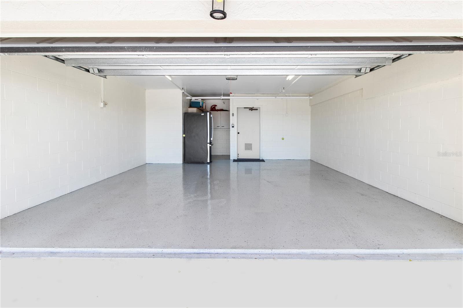 2 Car garage with epoxy floors. Plus extra storage in the garage. Hurricane doors - 4565 BAY CLUB DR #27, BRADENTON