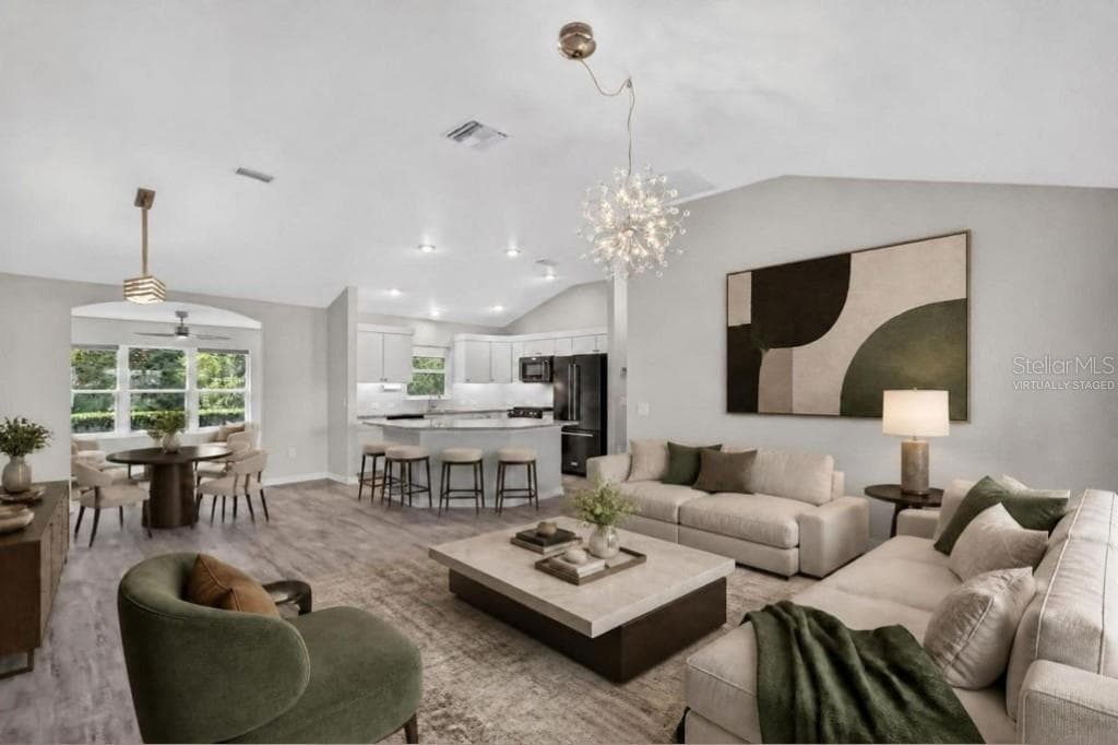 Living, Dining, and Kitchen-Virtually Staged - 3254 ZIPPERER WAY, THE VILLAGES