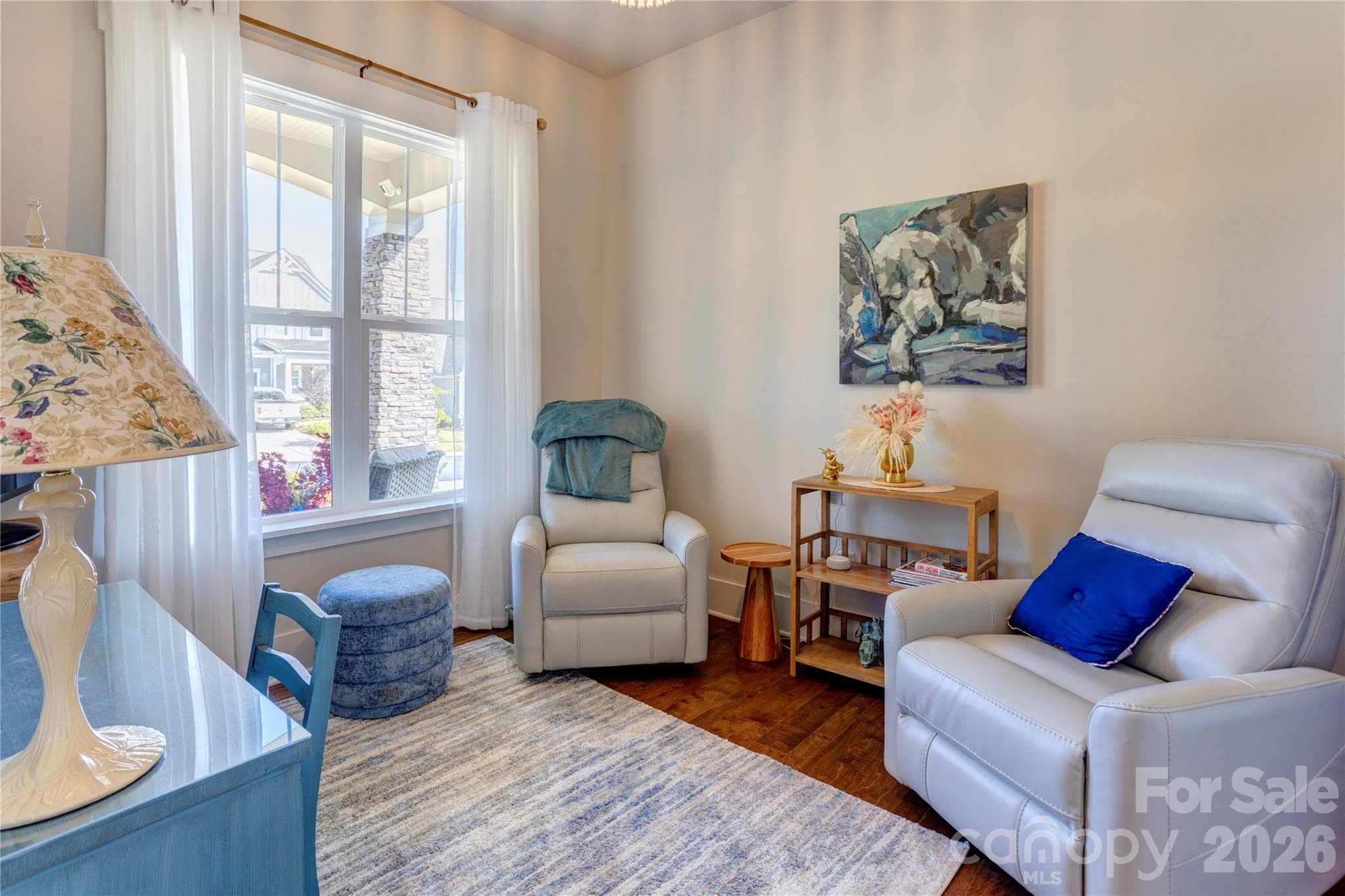 A flexible guest room, currently set up as a cozy sitting room. Use it for overnight family, a home office, or a reading retreat. - 158 Fulworth Drive NW, Concord