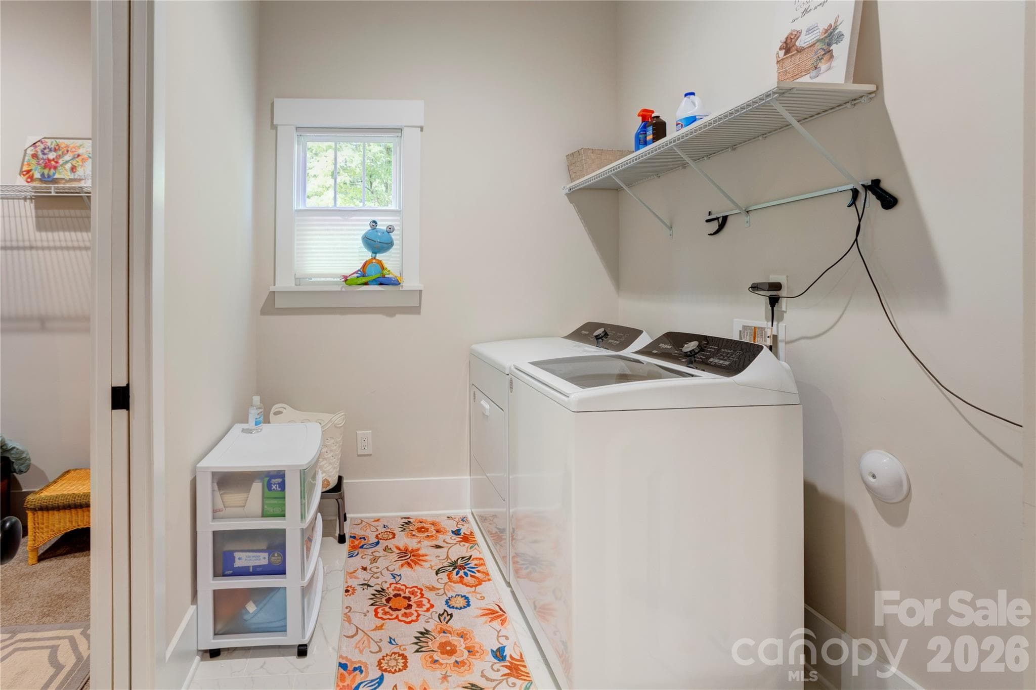 A separate laundry room with space to work, conveniently located near the garage entry with direct access to the primary suite. - 158 Fulworth Drive NW, Concord