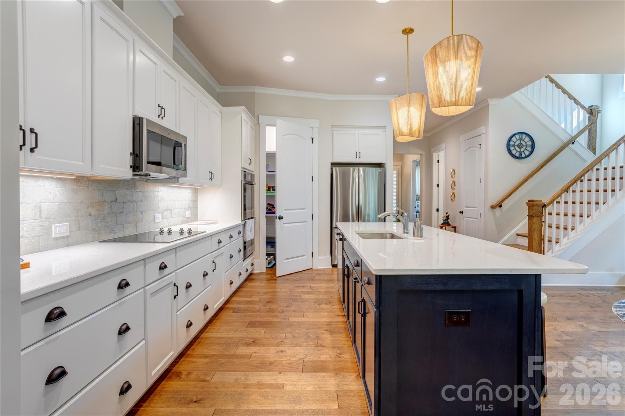 Open to the dining and living areas, so the cook is never left out of the conversation. - 158 Fulworth Drive NW, Concord
