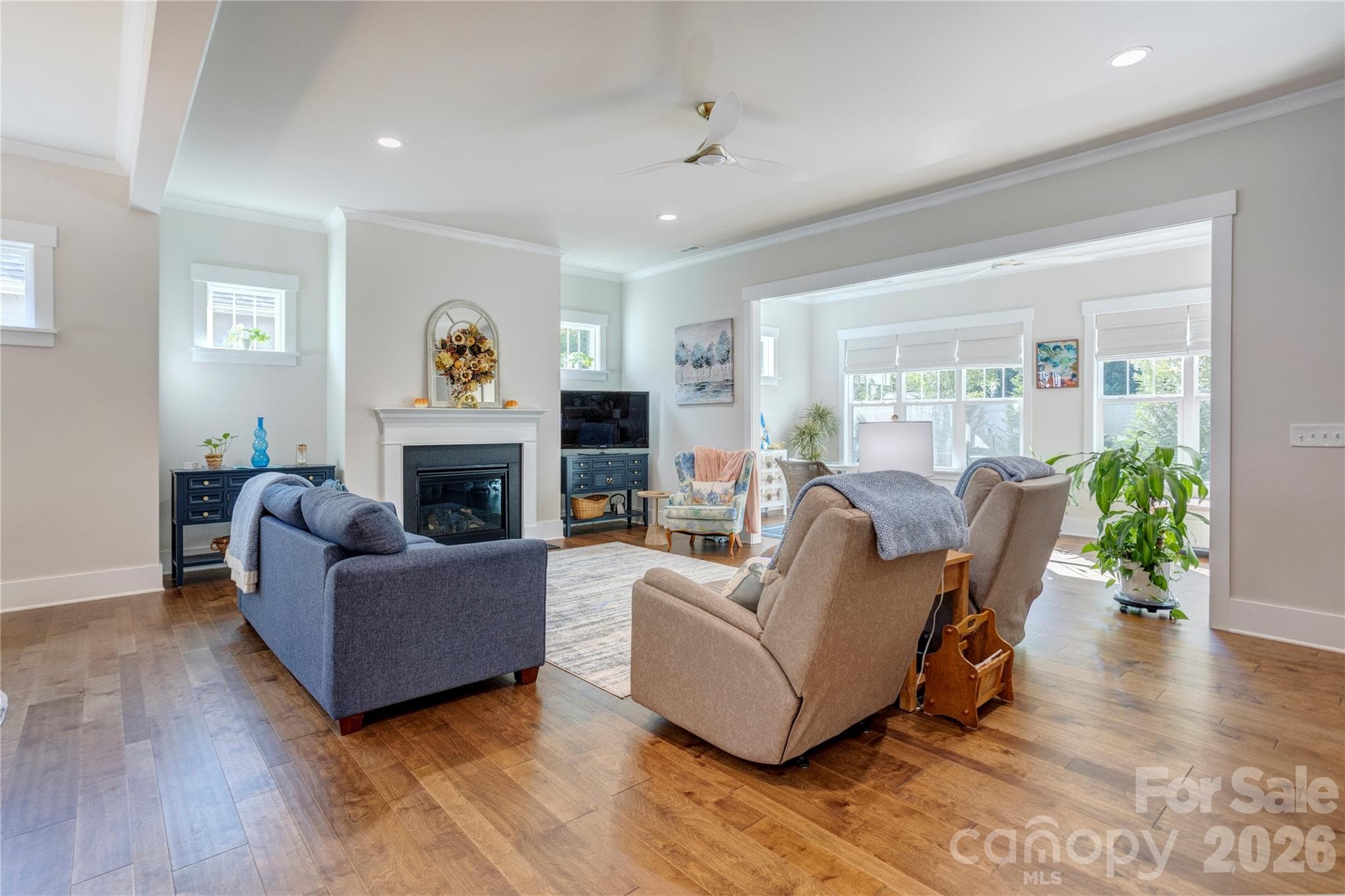 The living room opens to a sunroom that fills the space with natural light. - 158 Fulworth Drive NW, Concord