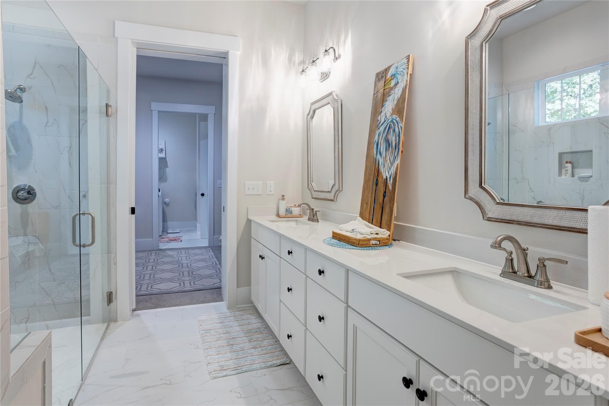 The primary bath features a double vanity, so everyone has their own space. - 158 Fulworth Drive NW, Concord