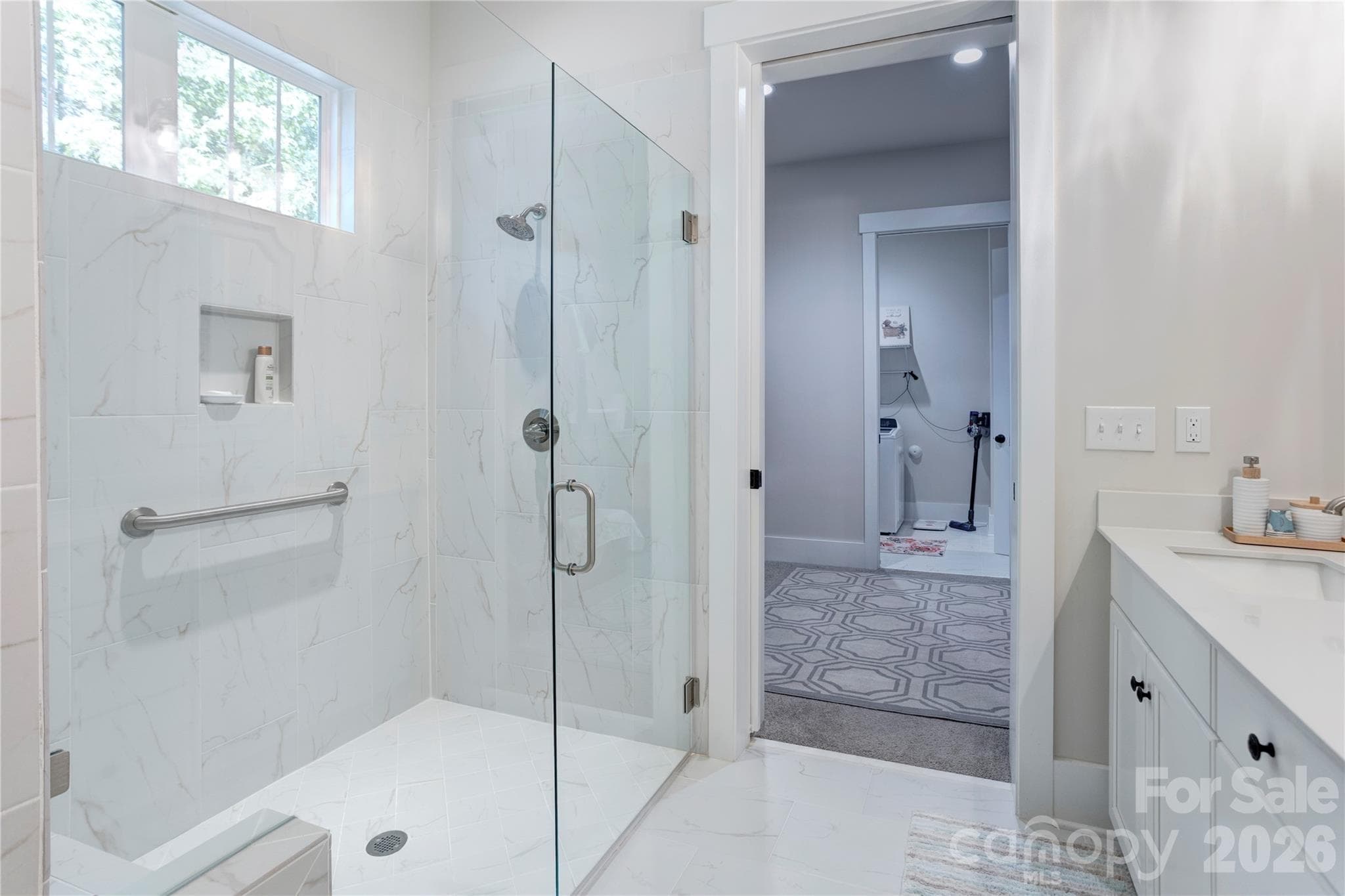 A zero-entry shower offers easy, step-free access and a clean, modern look. - 158 Fulworth Drive NW, Concord