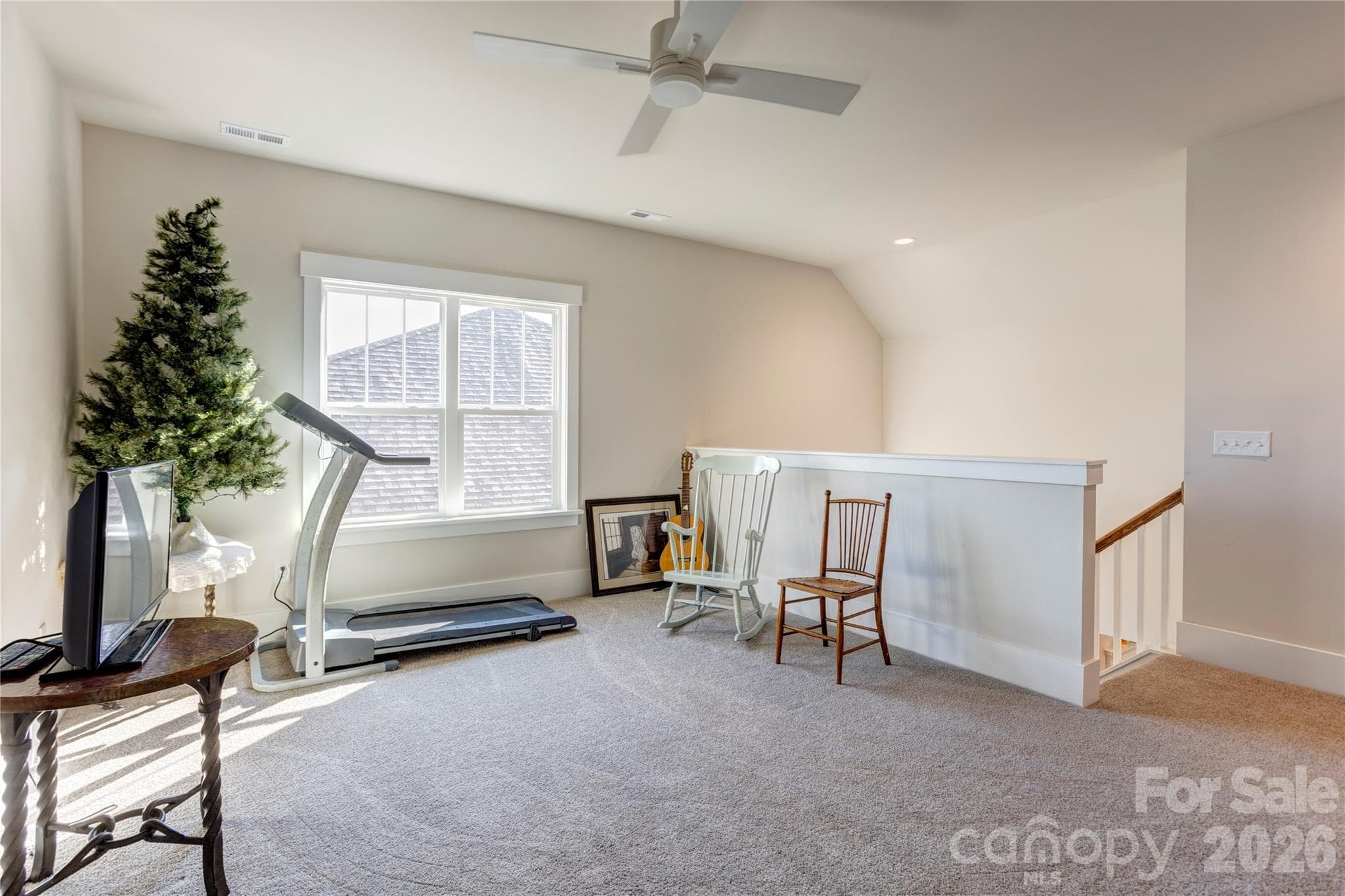 The loft offers privacy and separation, ideal for visiting family or a creative workspace. - 158 Fulworth Drive NW, Concord