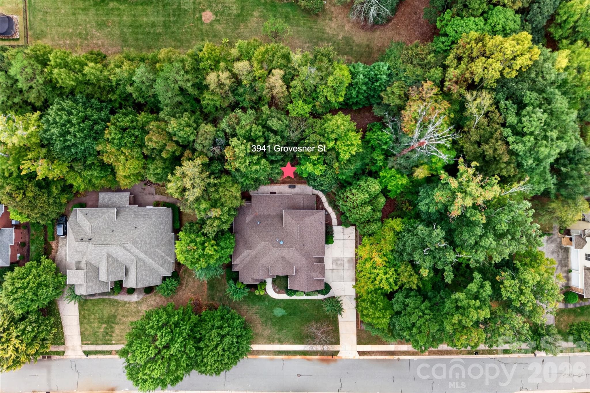 Home is surrounded by trees with a private, wooded, fenced-in backyard. - 3941 Grovesner Street, Harrisburg