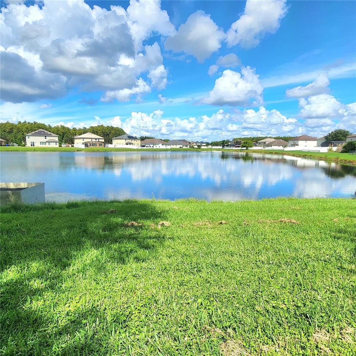 Home overlooks a picturesque pond. - 3899 CEDAR HAMMOCK TRL, ST CLOUD