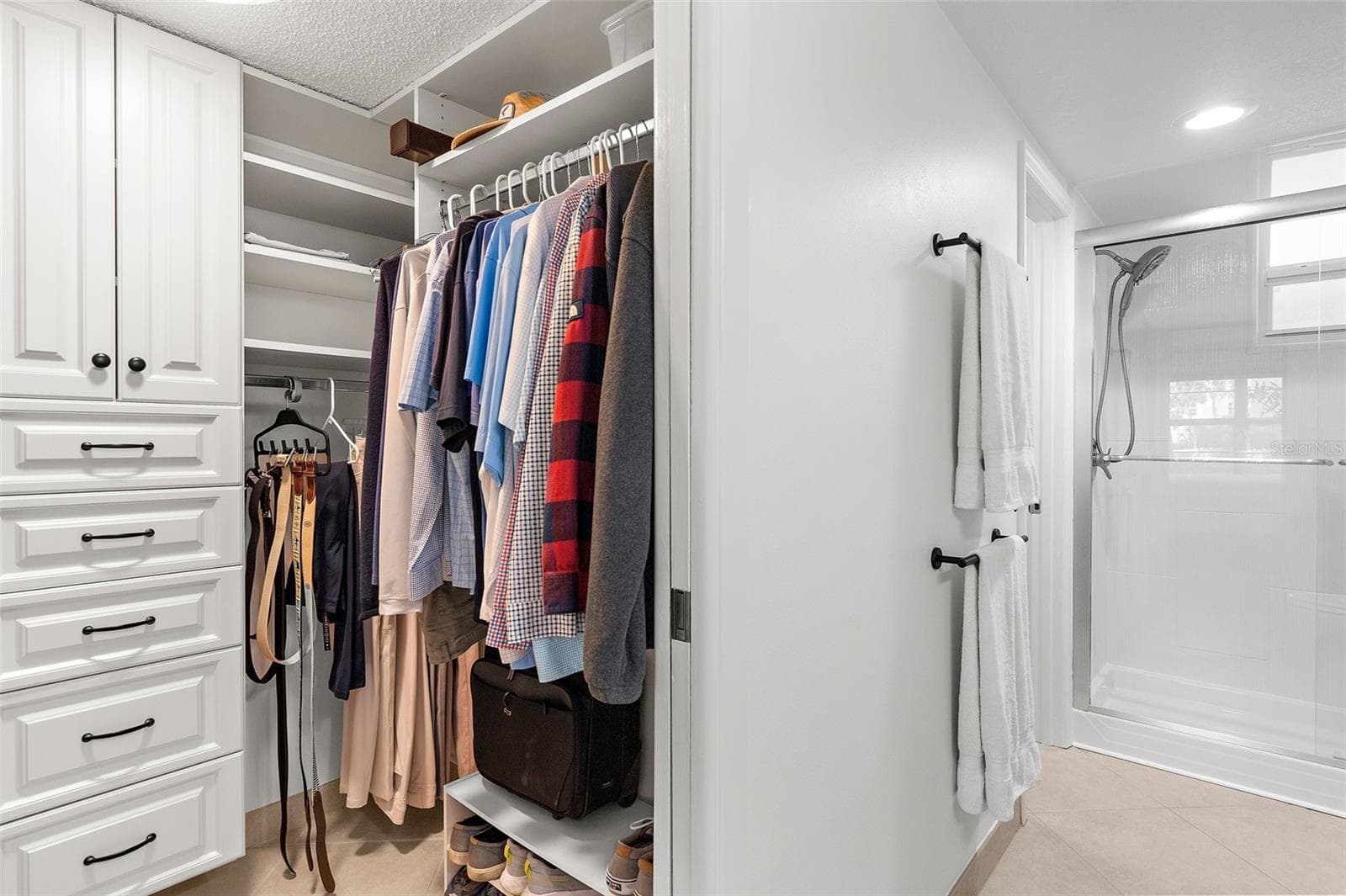 Primary Walk-In Closet with lots of storage space - 600 SUTTON PL #101B, LONGBOAT KEY