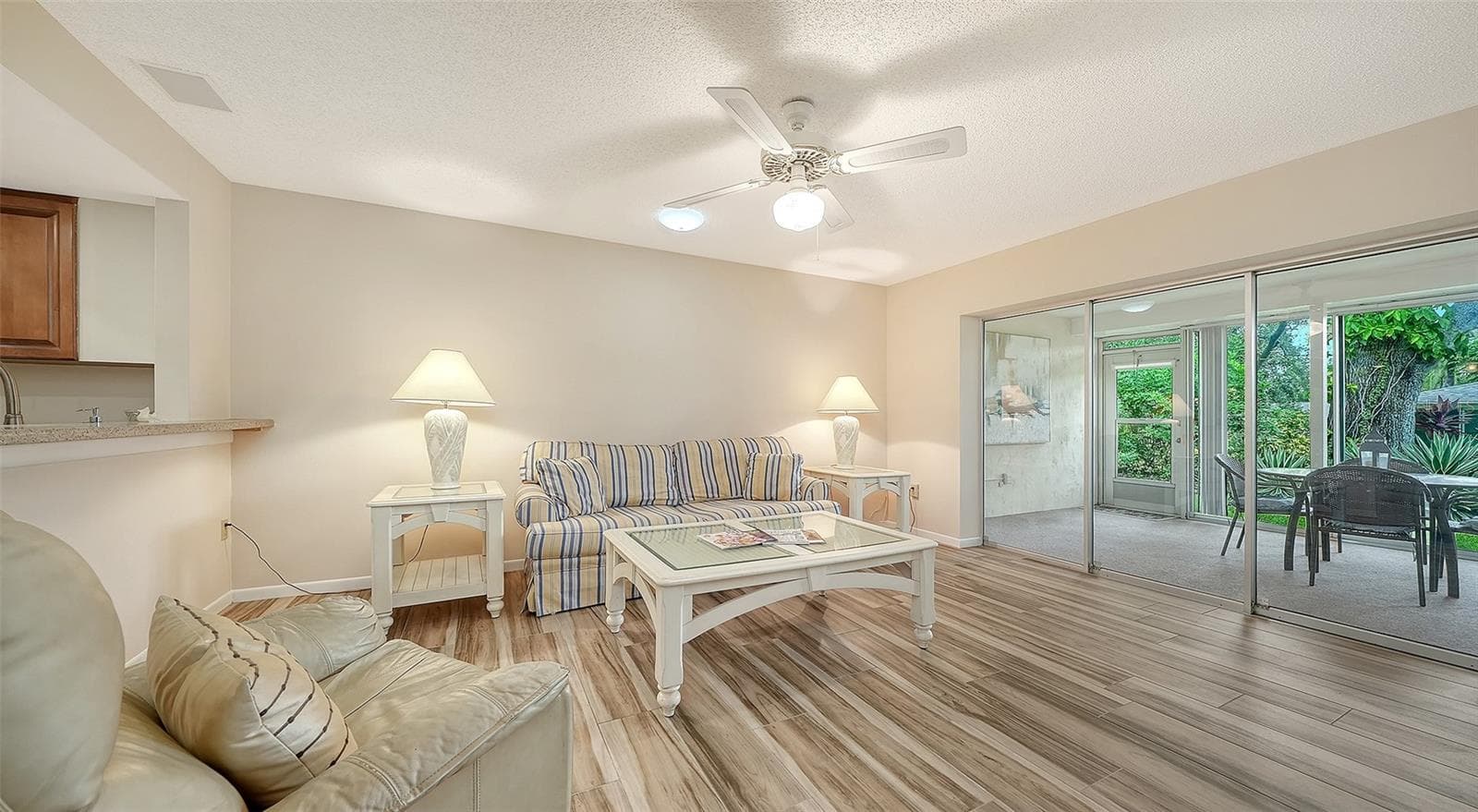 The family room and kitchen are connected and welcoming. - 4207 BOWLING GREEN CIR, SARASOTA