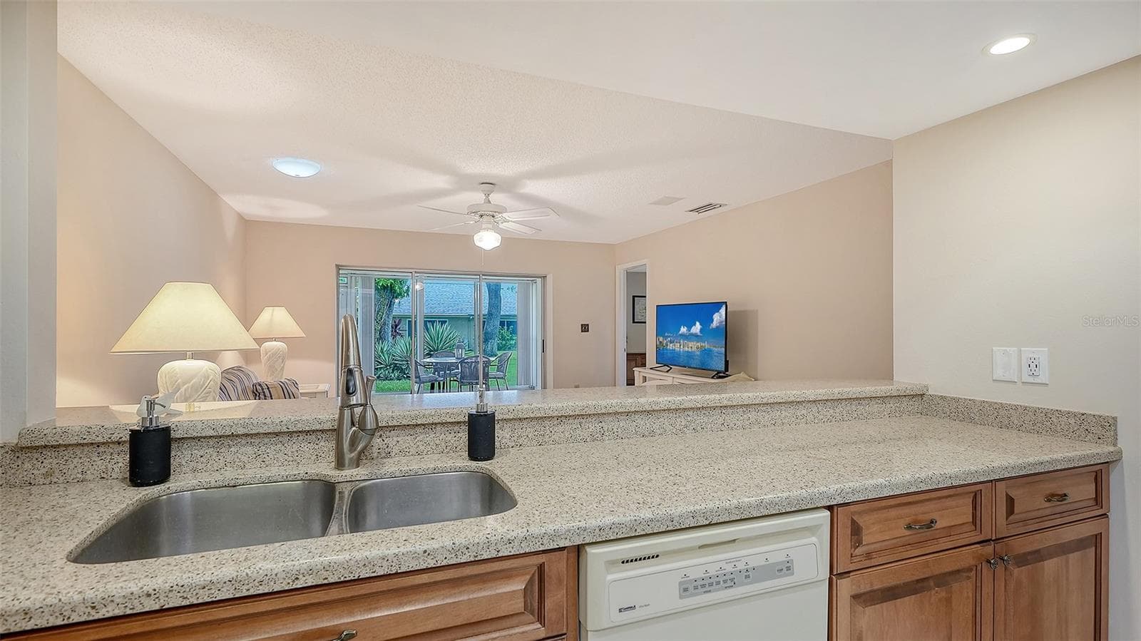 The view from the kitchen is tranquil and light. - 4207 BOWLING GREEN CIR, SARASOTA