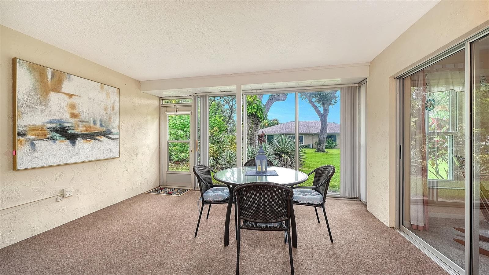 A large lanai with glass and screens. - 4207 BOWLING GREEN CIR, SARASOTA