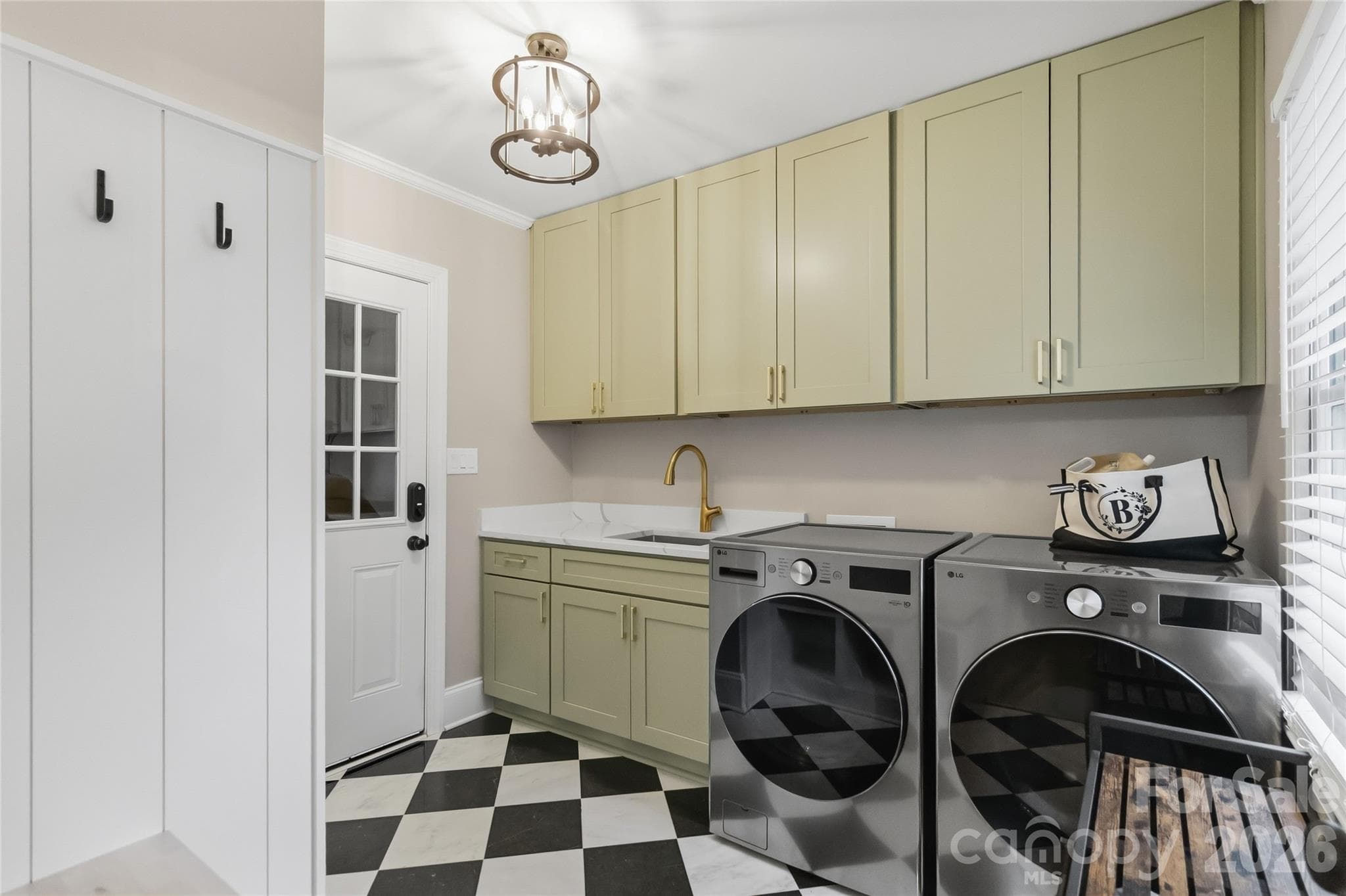 Mud/ Laundry room from garage entry, newly renovated - 9414 Tillot Drive, Matthews