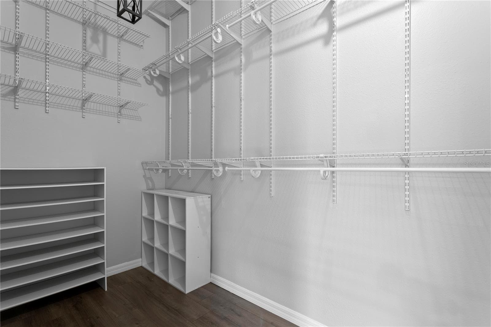 The primary bedroom's walk-in closet maximizes storage with high ceilings. - 6402 RUBIA CIR, APOLLO BEACH