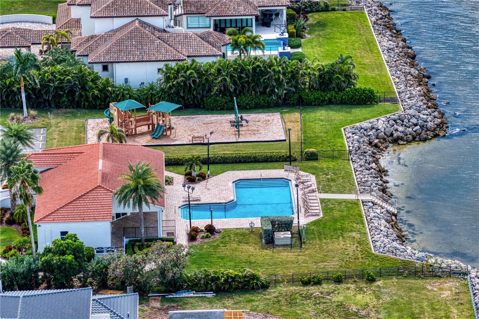 Enjoy sunset views from the community pool and clubhouse. - 6402 RUBIA CIR, APOLLO BEACH