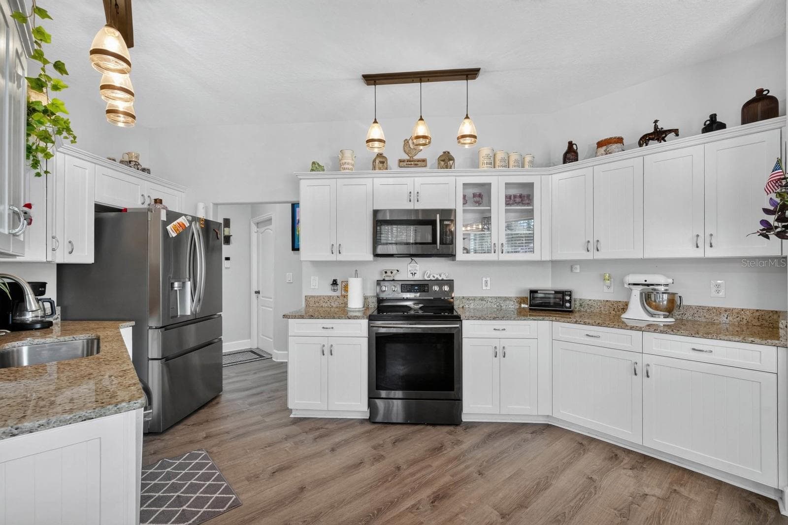 Large kitchen with granite counters and newer stainless appliances - 72 KARAS TRL, PALM COAST