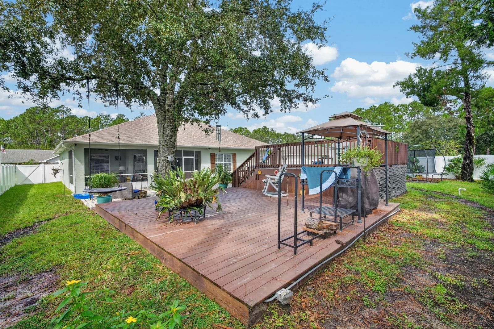 Large deck features beautiful oak shade tree - 72 KARAS TRL, PALM COAST