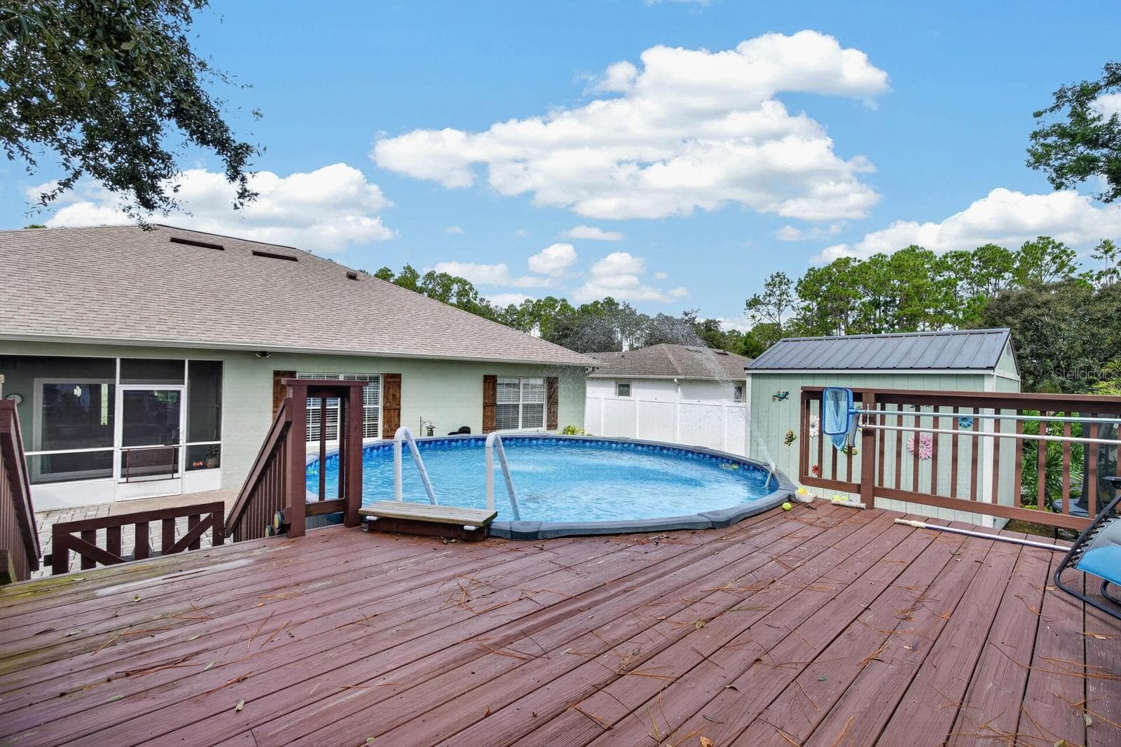 above ground pool with decking features coded gate for extra safety - 72 KARAS TRL, PALM COAST