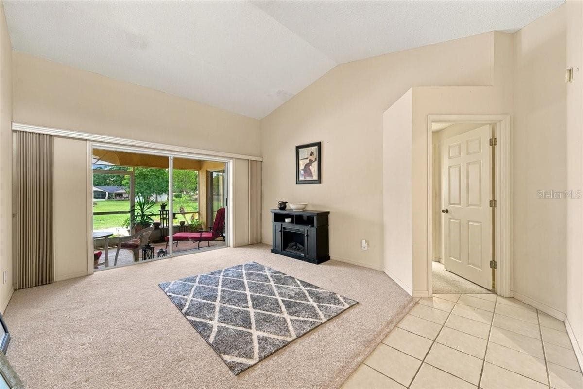 Formal Living Room with Sliding Doors to back screened lanai - 4437 FLINTLOCK LOOP, LAKELAND