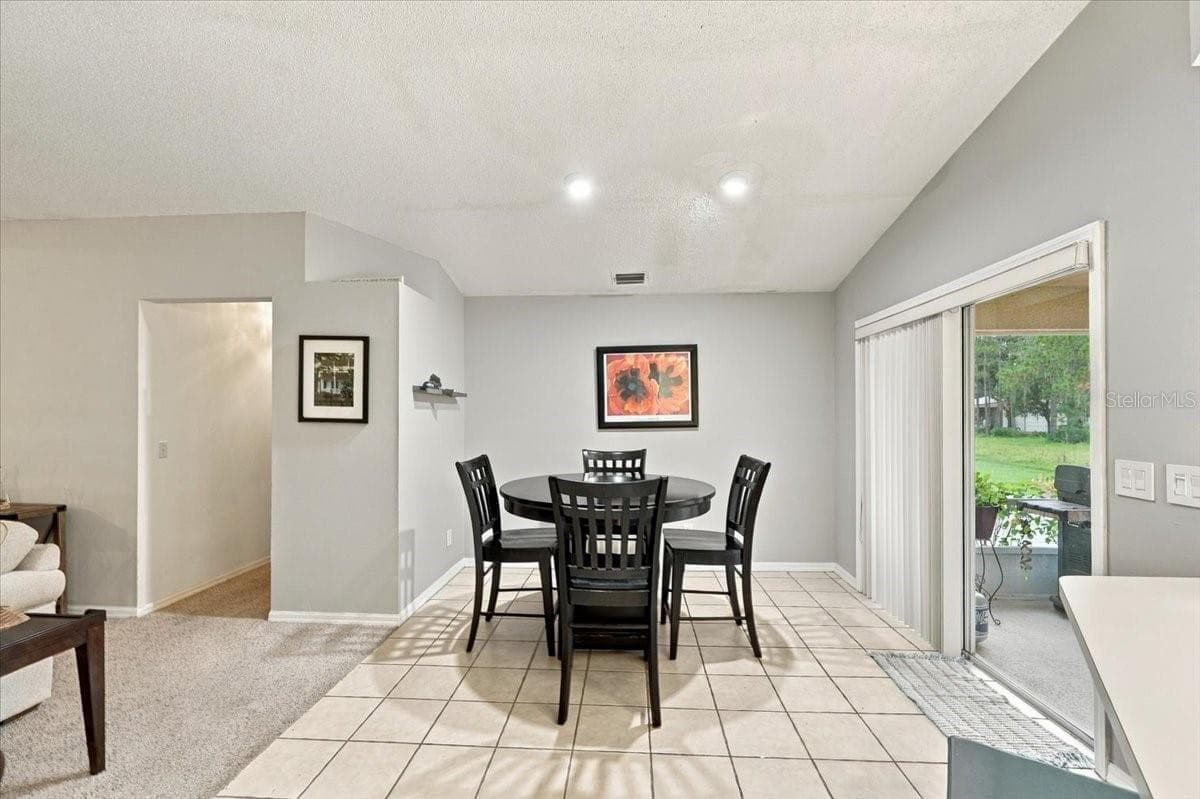 Breakfast Nook off of Family Room and Kitchen with Sliding Doors to the back screened lanai - 4437 FLINTLOCK LOOP, LAKELAND