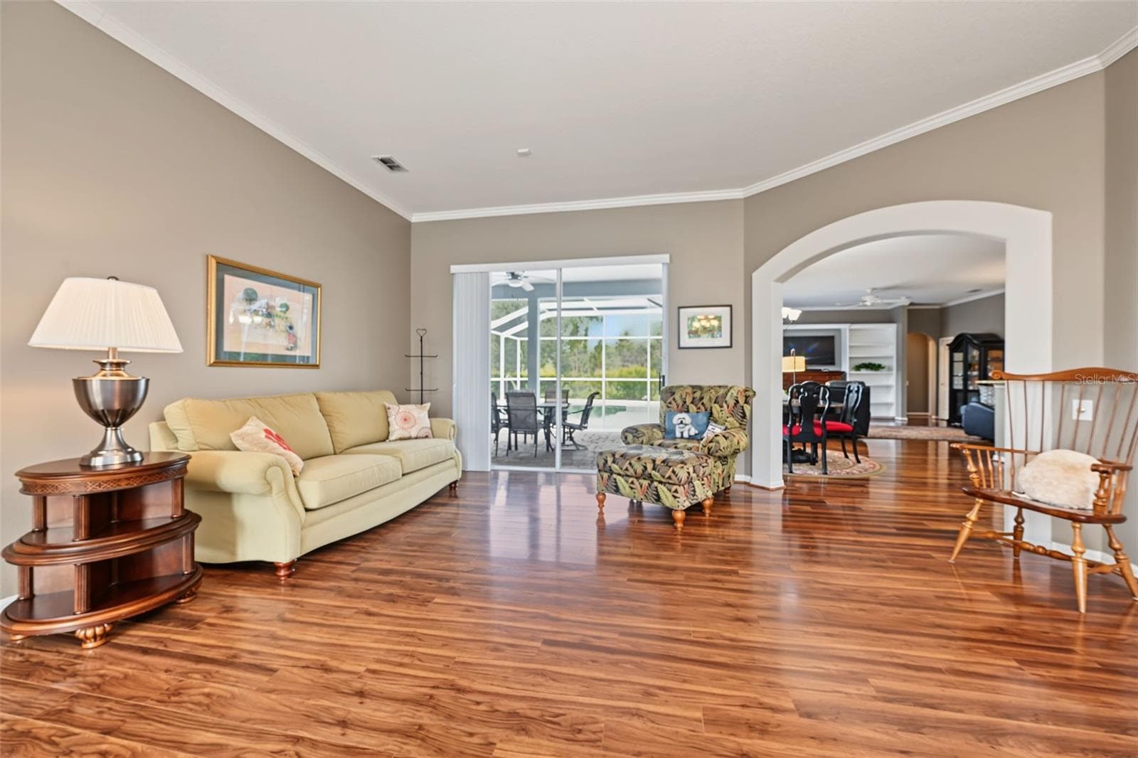 Formal living room with sliders to lanai/pool area - 1028 HAGEN DR, NEW PORT RICHEY