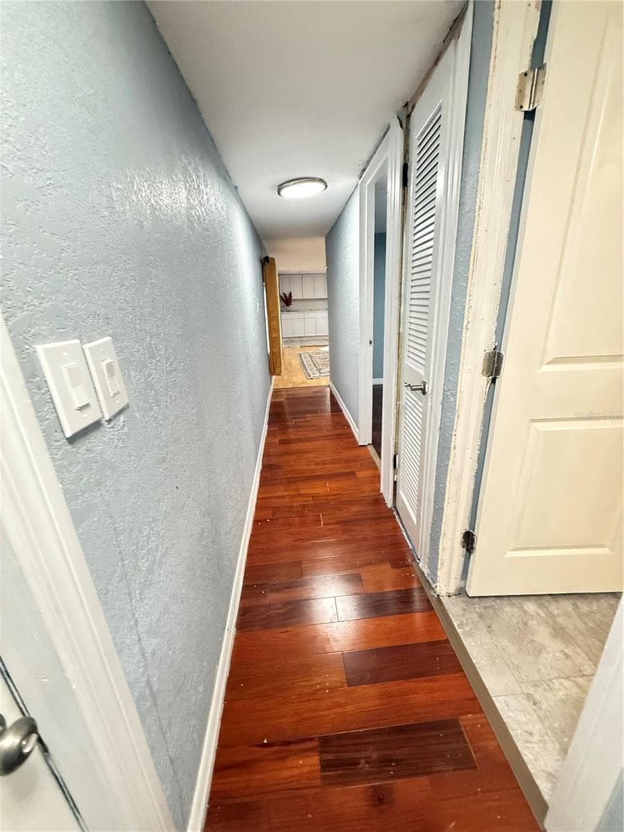 HALL TO BATHROOM AND BERROOMS - 6905 AZLEE AVE, NEW PORT RICHEY